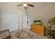 Guest bedroom with a closet, dresser, and a neutral color palette at 1943 E Drake Dr, Tempe, AZ 85283
