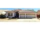 Charming single-story home with a tile roof, arched window, desert landscaping, and two-car garage at 1943 E Drake Dr, Tempe, AZ 85283