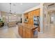 Spacious kitchen featuring oak cabinets, granite countertops, stainless appliances, and center island at 1943 E Drake Dr, Tempe, AZ 85283
