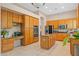 Open kitchen featuring an island, built in appliances, and ample oak cabinetry at 1943 E Drake Dr, Tempe, AZ 85283