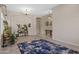 Open-concept living room with archway to front entry, neutral color palette, and tile flooring at 1943 E Drake Dr, Tempe, AZ 85283