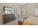 Spacious main bedroom with a TV, private patio access, and wood-look flooring at 1943 E Drake Dr, Tempe, AZ 85283