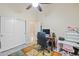 Functional home office with desk, shelving, and a view into another room at 1943 E Drake Dr, Tempe, AZ 85283