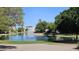 Community pond with fountain and mature trees lining the edge at 1943 E Drake Dr, Tempe, AZ 85283