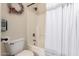 Clean bathroom featuring a white tub and shower combination with neutral wall tiles at 23119 W Papago St, Buckeye, AZ 85326