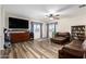 Large bonus room offers ample space, natural light, a ceiling fan, and a flexible layout for various activities at 23119 W Papago St, Buckeye, AZ 85326