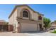 The home's front elevation reveals its two-story design, a large garage, and appealing architectural elements at 23119 W Papago St, Buckeye, AZ 85326