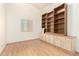 Well-lit bedroom with custom built-in shelves and storage cabinets at 2356 N Glenview --, Mesa, AZ 85213