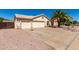 Charming home featuring a spacious driveway, three-car garage and desert landscaping at 2356 N Glenview --, Mesa, AZ 85213