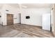 Bright living room with vaulted ceilings, modern flooring, and a mounted flat screen television at 2356 N Glenview --, Mesa, AZ 85213