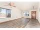 Bright living room featuring hardwood flooring, natural light, and updated fixtures at 2356 N Glenview --, Mesa, AZ 85213