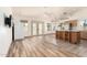 Open concept living area with hardwood flooring, an island, and exterior access at 2356 N Glenview --, Mesa, AZ 85213