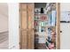 Walk-in pantry with wooden door offering ample storage and organization for groceries and kitchen essentials at 2356 N Glenview --, Mesa, AZ 85213