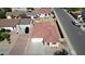 Aerial view of single-story home showcasing a tile roof, desert landscaping, and an attached two-car garage at 2358 E Peach Tree Dr, Chandler, AZ 85249