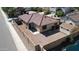 Aerial view showcases a red tile roof, a gravel yard, a detached shed, and a block wall fence at 2358 E Peach Tree Dr, Chandler, AZ 85249