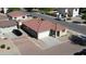 Aerial view of a single-story home with a red tile roof, two-car garage, and fenced backyard in a residential area at 2358 E Peach Tree Dr, Chandler, AZ 85249