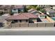 Aerial view highlighting a red tile roof, block wall fence, gravel yard, detached shed, and neighboring properties at 2358 E Peach Tree Dr, Chandler, AZ 85249