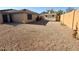 Spacious backyard featuring a shed and low-maintenance desert landscaping and a cozy patio area at 2358 E Peach Tree Dr, Chandler, AZ 85249