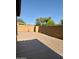Backyard view with extended patio, desert landscaping and block fence for privacy at 2358 E Peach Tree Dr, Chandler, AZ 85249