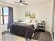 This bedroom features a ceiling fan, a window, and comfy carpet creating a welcoming retreat at 2358 E Peach Tree Dr, Chandler, AZ 85249