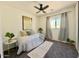 Comfortable bedroom with a ceiling fan, window with curtains, and carpet for a cozy retreat at 2358 E Peach Tree Dr, Chandler, AZ 85249