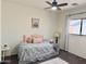 Bright bedroom with a ceiling fan, window with curtains, and carpet for a comfortable living space at 2358 E Peach Tree Dr, Chandler, AZ 85249