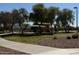 Community park featuring covered playground equipment, benches, and mature landscaping at 2358 E Peach Tree Dr, Chandler, AZ 85249