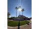 Cooper Commons neighborhood sign surrounded by palm trees, manicured landscaping, and a home in the background at 2358 E Peach Tree Dr, Chandler, AZ 85249