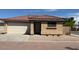 Charming single-story home showcasing a well-maintained front yard with a neutral desert landscape at 2358 E Peach Tree Dr, Chandler, AZ 85249