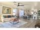 Open living area featuring a plush sofa, stylish decor, and bright ambiance at 2358 E Peach Tree Dr, Chandler, AZ 85249