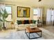 Comfortable living room featuring a plush sofa, stylish decor, and ample natural light at 2358 E Peach Tree Dr, Chandler, AZ 85249
