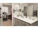 Bathroom featuring gray cabinetry, a double vanity, and modern fixtures at 2418 W Jake Hvn, Phoenix, AZ 85085