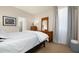 Bedroom with light walls, carpet, and an ensuite bathroom at 2418 W Jake Hvn, Phoenix, AZ 85085