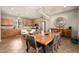 Open dining room features stylish lighting, modern table, and easy access to the kitchen and outdoors at 2418 W Jake Hvn, Phoenix, AZ 85085