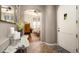 Welcoming foyer with stylish decor leading to open-concept living spaces with hardwood floors at 2418 W Jake Hvn, Phoenix, AZ 85085