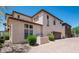 Stunning two-story home exterior features brick driveway, beautiful windows, and desert landscaping at 2418 W Jake Hvn, Phoenix, AZ 85085