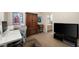 Office with desk and chair and a view to a clean ensuite bathroom at 2418 W Jake Hvn, Phoenix, AZ 85085
