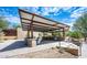 Outdoor kitchen features a built-in barbecue grill and an adjacent seating area to provide for outdoor dining at 2418 W Jake Hvn, Phoenix, AZ 85085