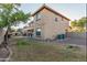 This backyard has a lush lawn, an outdoor fireplace, and a grill at 26529 N 167Th Ave, Surprise, AZ 85387