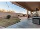 The backyard features a covered patio, fireplace, desert landscaping and plenty of space at 26529 N 167Th Ave, Surprise, AZ 85387