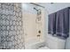 Clean bathroom featuring a shower-tub combo, modern fixtures, and fresh towels at 26529 N 167Th Ave, Surprise, AZ 85387