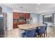 Well-appointed kitchen featuring stainless steel appliances, a central island, and bright, modern lighting at 26529 N 167Th Ave, Surprise, AZ 85387