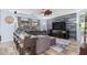 The open-concept living room includes luxury vinyl plank flooring, a modern ceiling fan and multiple windows at 26529 N 167Th Ave, Surprise, AZ 85387