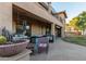 The backyard patio includes a grill, sitting area, and access to an upper level balcony at 26529 N 167Th Ave, Surprise, AZ 85387