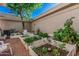 Charming backyard garden featuring raised garden beds, perfect for growing plants and creating a serene outdoor oasis at 2989 N 44Th St # 3044, Phoenix, AZ 85018