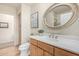 Well-lit bathroom with a large mirror, vanity sink, and a separate toilet area at 2989 N 44Th St # 3044, Phoenix, AZ 85018