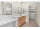 Bathroom with a large mirror, sink with cabinets, and walk-in closet at 2989 N 44Th St # 3044, Phoenix, AZ 85018