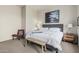 Comfortable bedroom with a cushioned headboard bed, stylish décor, and a sitting area at 2989 N 44Th St # 3044, Phoenix, AZ 85018