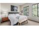 Cozy bedroom with large window, bench, and stylish furnishings offers a relaxing retreat at 2989 N 44Th St # 3044, Phoenix, AZ 85018