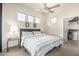 Serene bedroom with three windows, a ceiling fan, and an adjacent closet at 2989 N 44Th St # 3044, Phoenix, AZ 85018